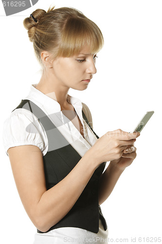 Image of Businesswoman reading message at phone