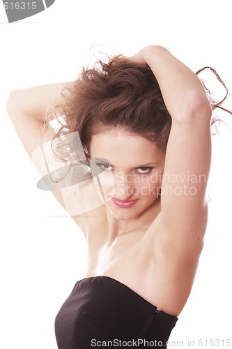 Image of Posing curled woman