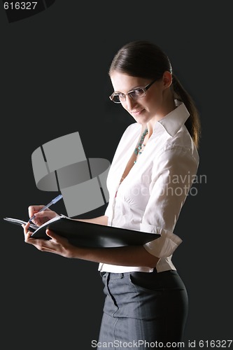 Image of Young businesswoman with folder