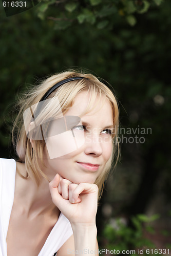 Image of Fair-haired girl looking aside