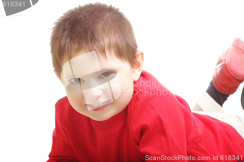 Image of Smiling laying boy