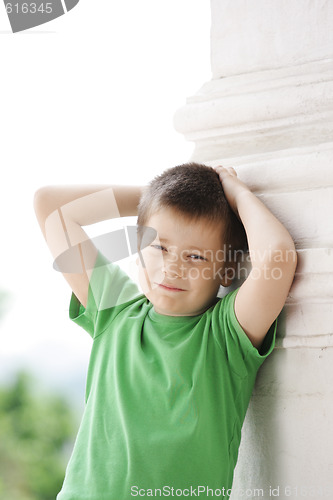 Image of Boy at column