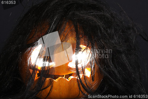 Image of Halloween pumpkin with black hairs