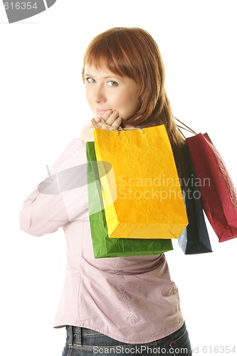 Image of Redhead girl with colored bags