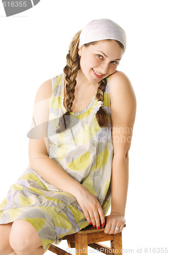 Image of Smiling girl on small bench