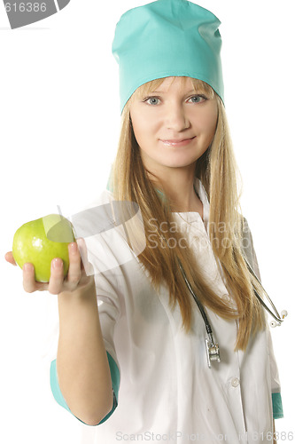 Image of Doctor holding out apple