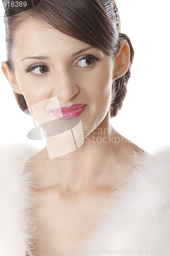 Image of Young pretty woman in fur coat