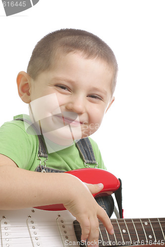 Image of Happy boy with guitar