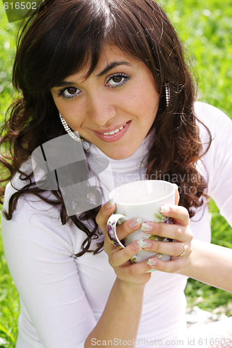 Image of Pretty girl with cup