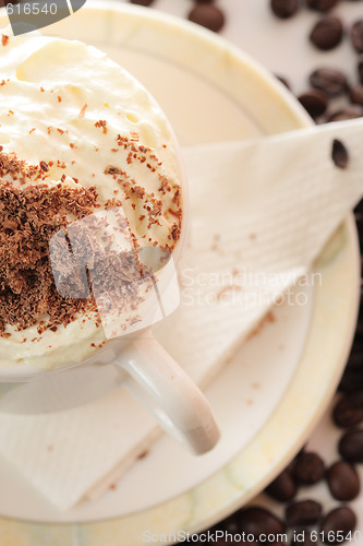 Image of Cappuccino and coffee beans