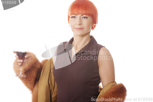 Image of Woman in fur coat with cocktail