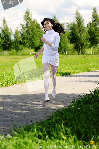 Image of Girl running in park
