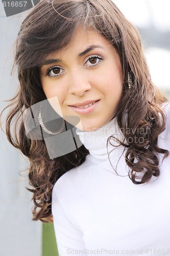 Image of Young brunette in white