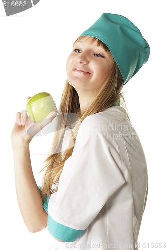 Image of Smiling doctor with green apple