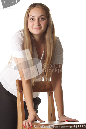 Image of Girl leaning on chair