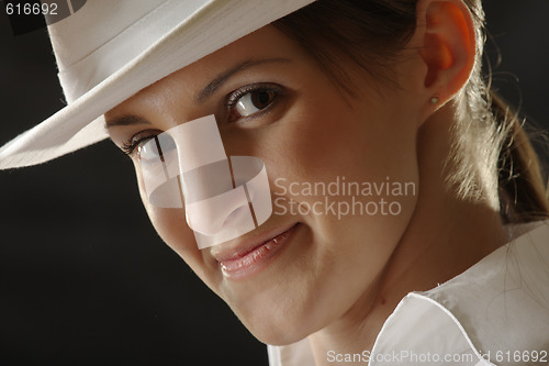 Image of Ironical girl in white hat