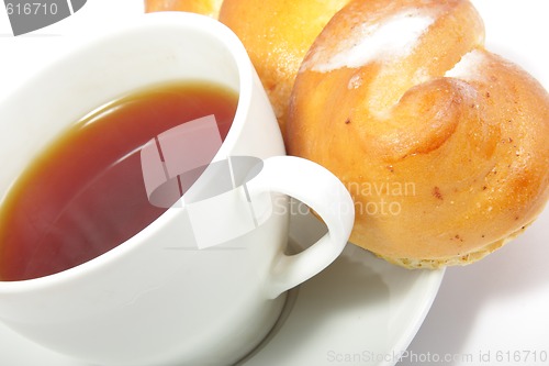 Image of Tea and bun close-up