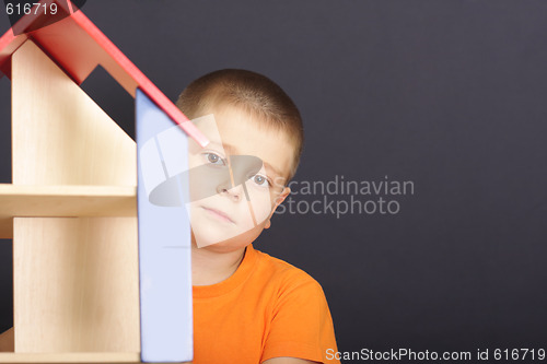Image of Looking out of toy house