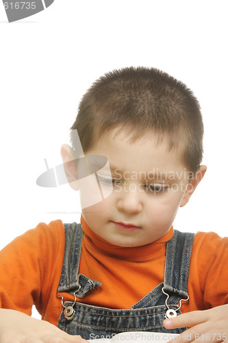 Image of Boy in orange reading book