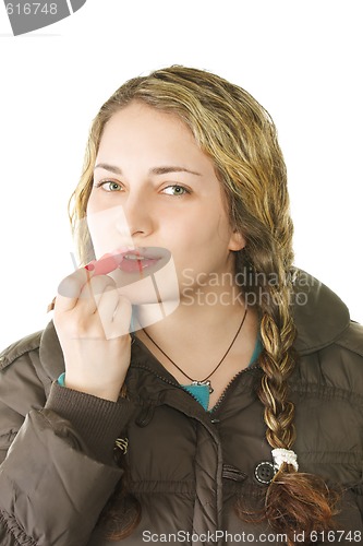 Image of Girl makes up lips