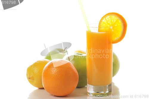 Image of Fresh juice with fruits behind