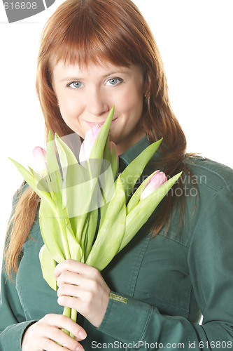 Image of Attractive redhead with tulips