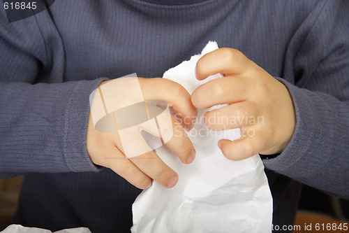 Image of Hands crumpling paper