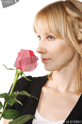 Image of Young woman with red rose sideview