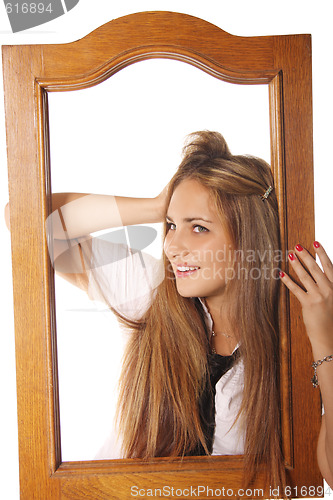 Image of Pretty girl in wooden frame