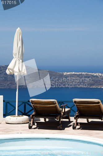 Image of swimming pool view of volcanic island and mediterranean sea