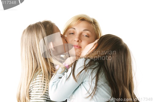 Image of Daughters kissing mommy