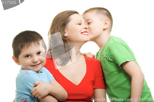 Image of Boy kisses on mommys cheeck