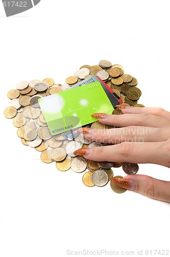 Image of Female hand, coins and cards