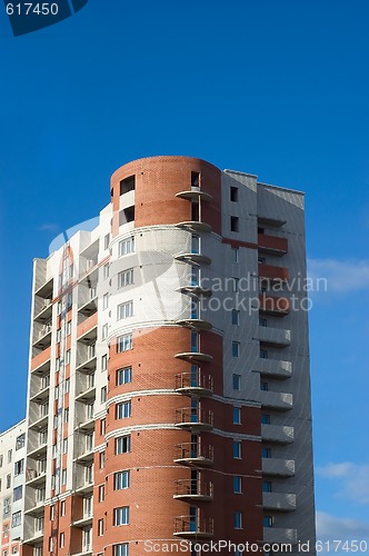 Image of High multistory house of red and white bricks 