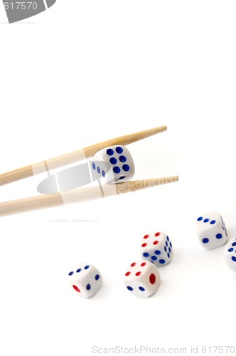 Image of Chopsticks and dices on white background