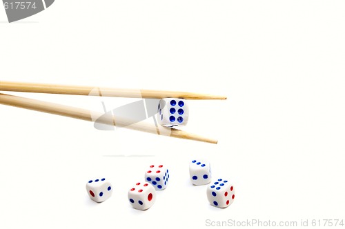 Image of Chopsticks and dices on white background