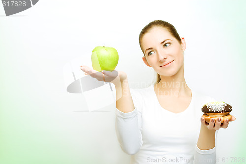 Image of choosing between apple and cake
