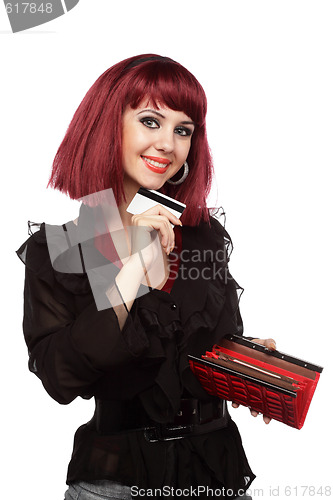 Image of Happy woman holding credit card and wallet