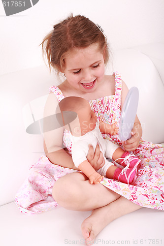 Image of Playing with doll