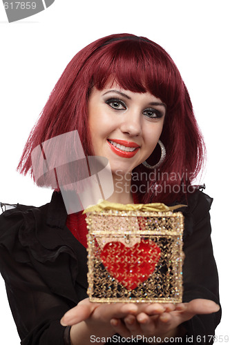 Image of Beautiful woman with heart packed in a golden gift box