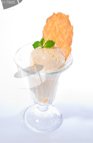Image of Vanilla ice cream with mint leaves and waffle