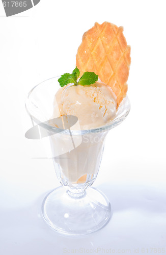 Image of Vanilla ice cream with mint leaves and waffle