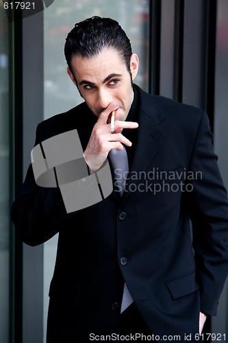 Image of Business man smoking