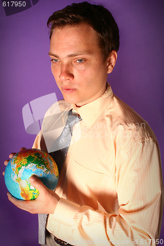 Image of Businessman with globe in his hands