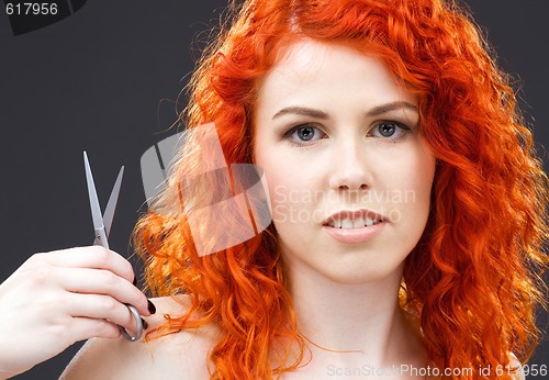 Image of redhead with scissors