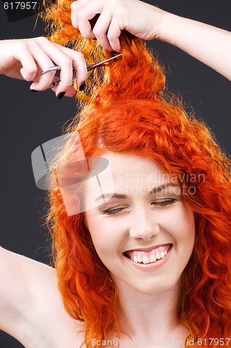 Image of redhead with scissors