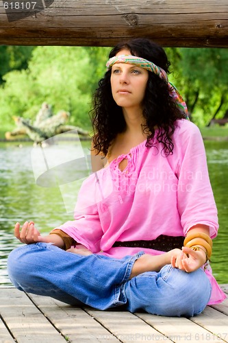 Image of hippie woman meditating