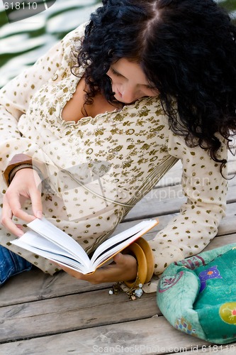 Image of woman reading a book 