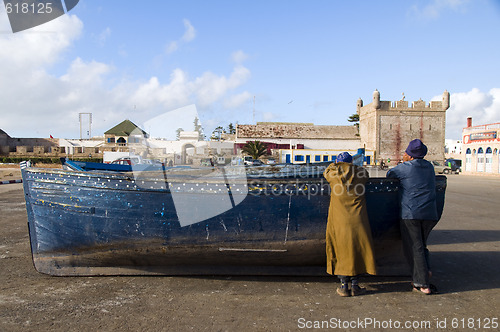 Image of african men on fishing boat essaouira morocco