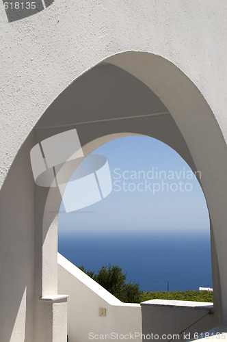 Image of classic greek island architecture with arches and sea view